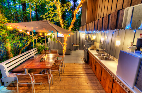 Outdoor deck designs with a kitchen